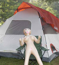 Pitched Tent with Blowup Doll in Chair